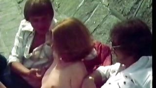 Two guys picking up a girl at the beach.