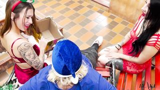 Two beautiful sluts in Christmas costumes sucking a lucky delivery man's cock